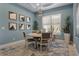 Well-lit dining room with blue walls, modern decor, and comfortable seating that creates a welcoming space at 13218 Sorrento Way, Bradenton, FL 34211