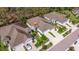 Aerial view of a home nestled among manicured lawns and tree-lined streets at 13574 Circa Crossing Dr, Lithia, FL 33547
