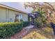 The home's backyard features a screened lanai surrounded by lush landscaping at 13574 Circa Crossing Dr, Lithia, FL 33547