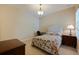 Cozy bedroom setup featuring comfortable bed and reading desk with ample natural light at 13574 Circa Crossing Dr, Lithia, FL 33547