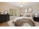 Inviting bedroom with a comfortable bed, soft lighting, and stylish decor, creating a serene atmosphere at 13574 Circa Crossing Dr, Lithia, FL 33547