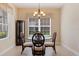 Cozy dining room featuring a glass-top table, stylish chairs, and a window with elegant valances at 13574 Circa Crossing Dr, Lithia, FL 33547