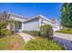 Single-story home featuring a well-manicured front yard and inviting walkway at 13574 Circa Crossing Dr, Lithia, FL 33547