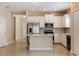 Open kitchen with white cabinets, stainless steel appliances, and a center island at 13574 Circa Crossing Dr, Lithia, FL 33547
