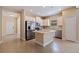 Well-lit kitchen with stainless steel appliances, light-colored cabinets, and a convenient center island at 13574 Circa Crossing Dr, Lithia, FL 33547