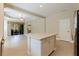 Open floor plan view into the dining and living area from the kitchen island at 13574 Circa Crossing Dr, Lithia, FL 33547