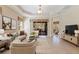 Bright, spacious living room with neutral tones, plush furnishings, and large windows leading to an outdoor space at 13574 Circa Crossing Dr, Lithia, FL 33547