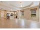 Spacious living area open to the kitchen with stainless steel appliances and tile flooring at 13574 Circa Crossing Dr, Lithia, FL 33547