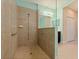 Luxurious walk-in shower featuring elegant tile work and modern fixtures, offering a spa-like experience at 13574 Circa Crossing Dr, Lithia, FL 33547