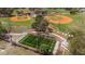 Aerial view of the community recreational area with baseball fields and fitness park at 13574 Circa Crossing Dr, Lithia, FL 33547