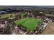 Aerial view of the football and baseball fields offering ample space for recreational activities at 13574 Circa Crossing Dr, Lithia, FL 33547