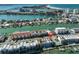 An aerial view shows the condo's ideal location near beaches, with a red pin marking the unit at 140 Brightwater Dr # 1, Clearwater Beach, FL 33767