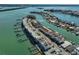 Aerial view highlighting waterfront townhomes featuring boat docks, beach access and rooftop terrace amenities at 140 Brightwater Dr # 1, Clearwater Beach, FL 33767