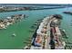 Aerial view of waterfront townhomes with private docks, conveniently near beach and highlighted by its rooftop terraces at 140 Brightwater Dr # 1, Clearwater Beach, FL 33767