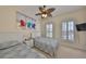 Charming bedroom featuring two twin beds, coastal-themed decor, and plenty of light at 140 Brightwater Dr # 1, Clearwater Beach, FL 33767