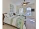 Bright guest bedroom with two beds, ceiling fan, and white shutters at 140 Brightwater Dr # 1, Clearwater Beach, FL 33767