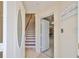 Inviting home foyer with stairs, garage access, and elegant coastal decor at 140 Brightwater Dr # 1, Clearwater Beach, FL 33767