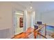 Upstairs hallway with laundry area and desk/workspace at 140 Brightwater Dr # 1, Clearwater Beach, FL 33767