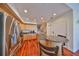Bright kitchen with granite counters, stainless steel appliances, and hardwood floors at 140 Brightwater Dr # 1, Clearwater Beach, FL 33767