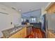 Open-concept kitchen with stainless steel appliances and granite countertops at 140 Brightwater Dr # 1, Clearwater Beach, FL 33767