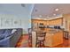 Open kitchen featuring stainless steel appliances, granite countertops, and hardwood floors at 140 Brightwater Dr # 1, Clearwater Beach, FL 33767