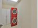 Laundry room featuring stacked, front-loading washer and dryer at 140 Brightwater Dr # 1, Clearwater Beach, FL 33767