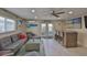 Inviting living room with beachy decor and access to an outdoor area at 140 Brightwater Dr # 1, Clearwater Beach, FL 33767