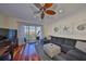 Stylish living room with water views, a large sectional sofa, and coastal-themed decor at 140 Brightwater Dr # 1, Clearwater Beach, FL 33767