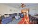 Open-concept living room flows into the kitchen, featuring hardwood floors and a large sectional at 140 Brightwater Dr # 1, Clearwater Beach, FL 33767
