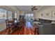 Relaxed living space with water views, dining area, hardwood floors, and beachy decor at 140 Brightwater Dr # 1, Clearwater Beach, FL 33767