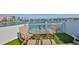 Enjoy the views from this rooftop deck with outdoor table and chairs at 140 Brightwater Dr # 1, Clearwater Beach, FL 33767