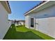 Large rooftop terrace with artificial turf and lounge chairs at 140 Brightwater Dr # 1, Clearwater Beach, FL 33767