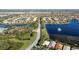 Aerial view showcasing a residential area with scenic lakes, and well-maintained roadways at 15908 Cobble Mill Dr, Wimauma, FL 33598