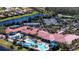 Aerial view of the community featuring tennis courts, pools and a stunning community center surrounded by nature at 15908 Cobble Mill Dr, Wimauma, FL 33598