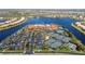 Aerial view of the community clubhouse with tennis courts, parking, and lush landscaping at 15908 Cobble Mill Dr, Wimauma, FL 33598