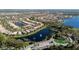 Aerial shot showcases the community with houses, lakes, fountains, and greenery at 15908 Cobble Mill Dr, Wimauma, FL 33598