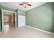 Spacious bedroom with tile flooring, neutral paint and ceiling fan at 15908 Cobble Mill Dr, Wimauma, FL 33598