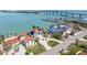 This is an aerial view of a waterfront home near a pier and features gorgeous water views and beautiful landscaping at 173 1St W St, Tierra Verde, FL 33715