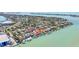Aerial view of waterfront property with dock; prime real estate on a sunny day with waterway views at 173 1St W St, Tierra Verde, FL 33715