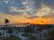 Panoramic aerial view capturing a stunning sunset, waterfront homes, and the expansive bridge at 173 1St W St, Tierra Verde, FL 33715