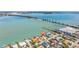 Aerial view of waterfront property with dock in a desirable location near the bridge and the coast at 173 1St W St, Tierra Verde, FL 33715