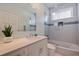 Bathroom featuring a shower-tub combo, modern fixtures, and a stylish sink with plenty of counter space at 173 1St W St, Tierra Verde, FL 33715
