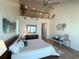 Bright bedroom features modern decor, vaulted ceiling, and balcony at 173 1St W St, Tierra Verde, FL 33715