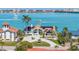 Stunning waterfront home boasts a private driveway, lush landscaping, and breathtaking ocean views at 173 1St W St, Tierra Verde, FL 33715