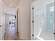 Hallway with doors to the bathroom and living area overlooking the ocean at 173 1St W St, Tierra Verde, FL 33715