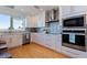 Beautiful kitchen with stainless steel appliances, granite countertops, and ample cabinet space at 173 1St W St, Tierra Verde, FL 33715