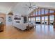 Bright living room featuring soaring ceilings, a cozy fireplace, and breathtaking water views at 173 1St W St, Tierra Verde, FL 33715