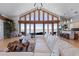 Elegant living room with floor to ceiling windows, an open layout, and scenic water views at 173 1St W St, Tierra Verde, FL 33715