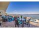 This expansive patio with comfortable outdoor seating looks out to gorgeous water views, perfect for entertaining at 173 1St W St, Tierra Verde, FL 33715