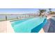 Inviting waterfront pool with bridge views, perfect for relaxation and entertaining guests at 173 1St W St, Tierra Verde, FL 33715